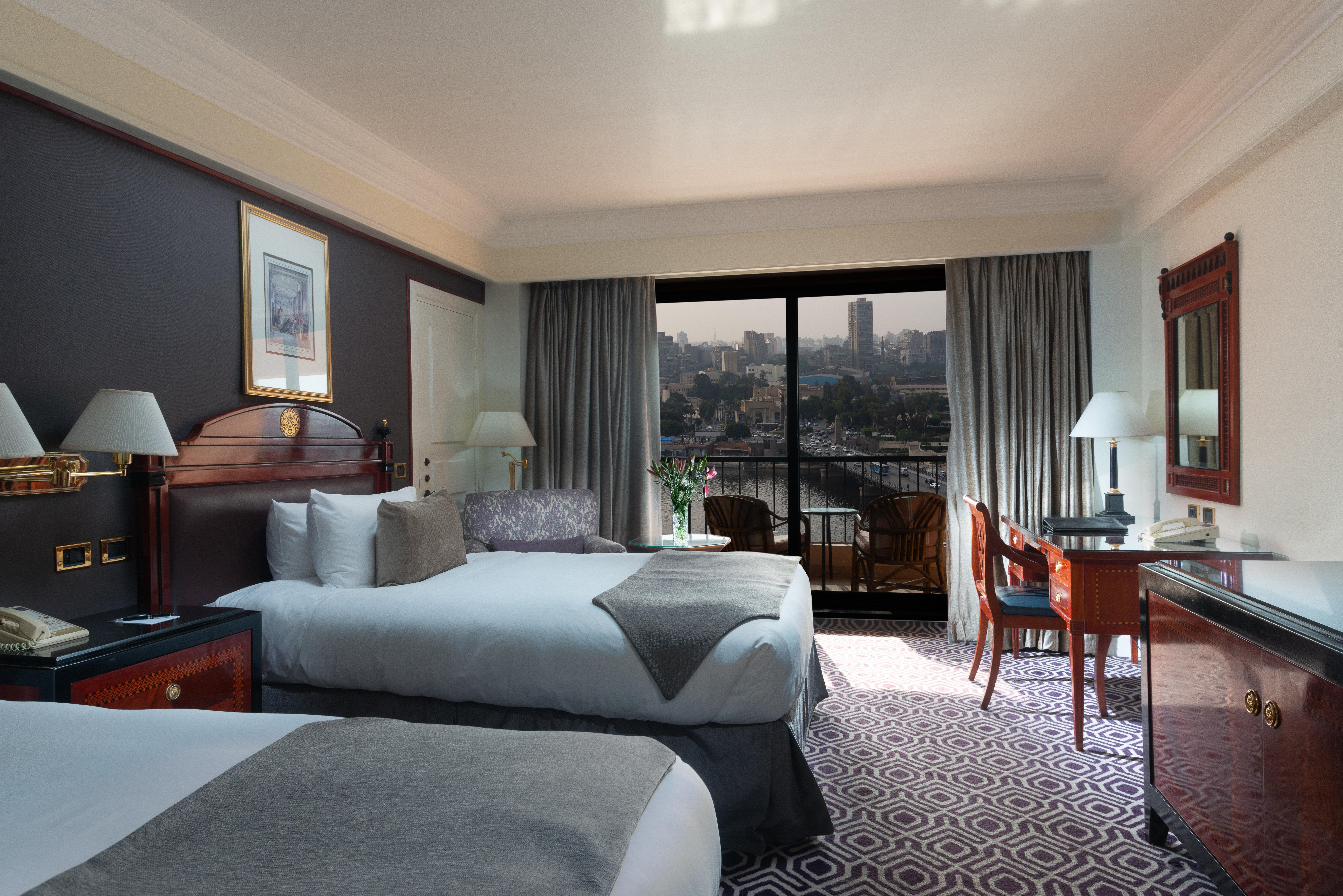 Intercontinental Cairo Semiramis By Ihg Hotel Exterior foto A room at the Nile Ritz-Carlton